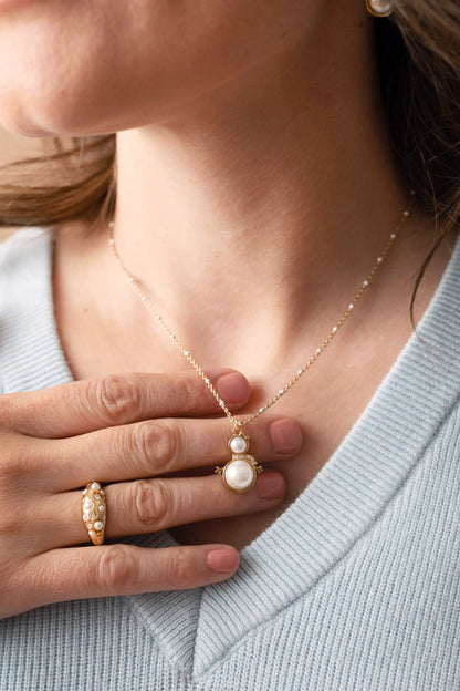 ALEX AND ANI Snowwoman Necklace with gold-tone chain and two pearl snowwoman pendant on Tampa Home & Garden Store