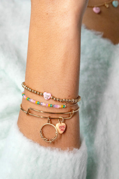 Cutie Pie bangles set of 2 by ALEX AND ANI; gold beads, pastel beads, and pink heart charm on Tampa Home & Garden Store