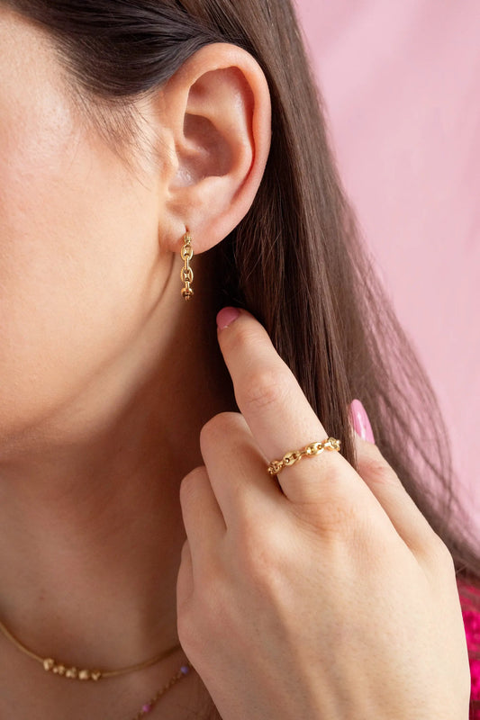 Frozen Mariner Chain Ring, gold-tone ring shown on finger with a matching gold bracelet on Tampa Home & Garden Store