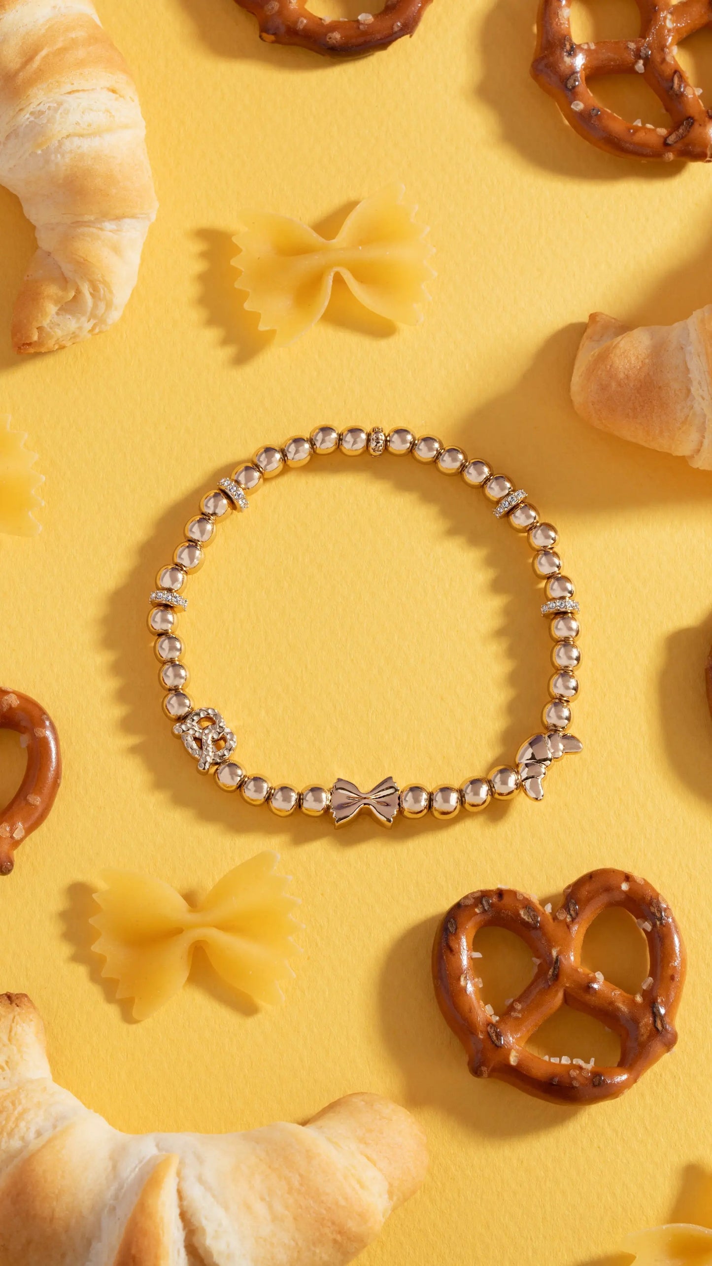 Carbs are My Love Language Beaded Stretch Bracelet by Alex and Ani; gold-tone beads with bow charm on Tampa Home & Garden Store