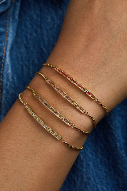 February Everyday Birthstone Pave Bolo Bracelet - gold-tone bar with multicolor pave stones, stacked on arm on Tampa Home & Garden Store
