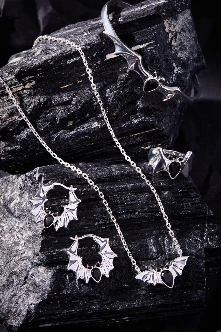 Crystal Bat Pendant necklace and five bat-themed rings in silver tone, ALEX AND ANI on Tampa Home & Garden Store