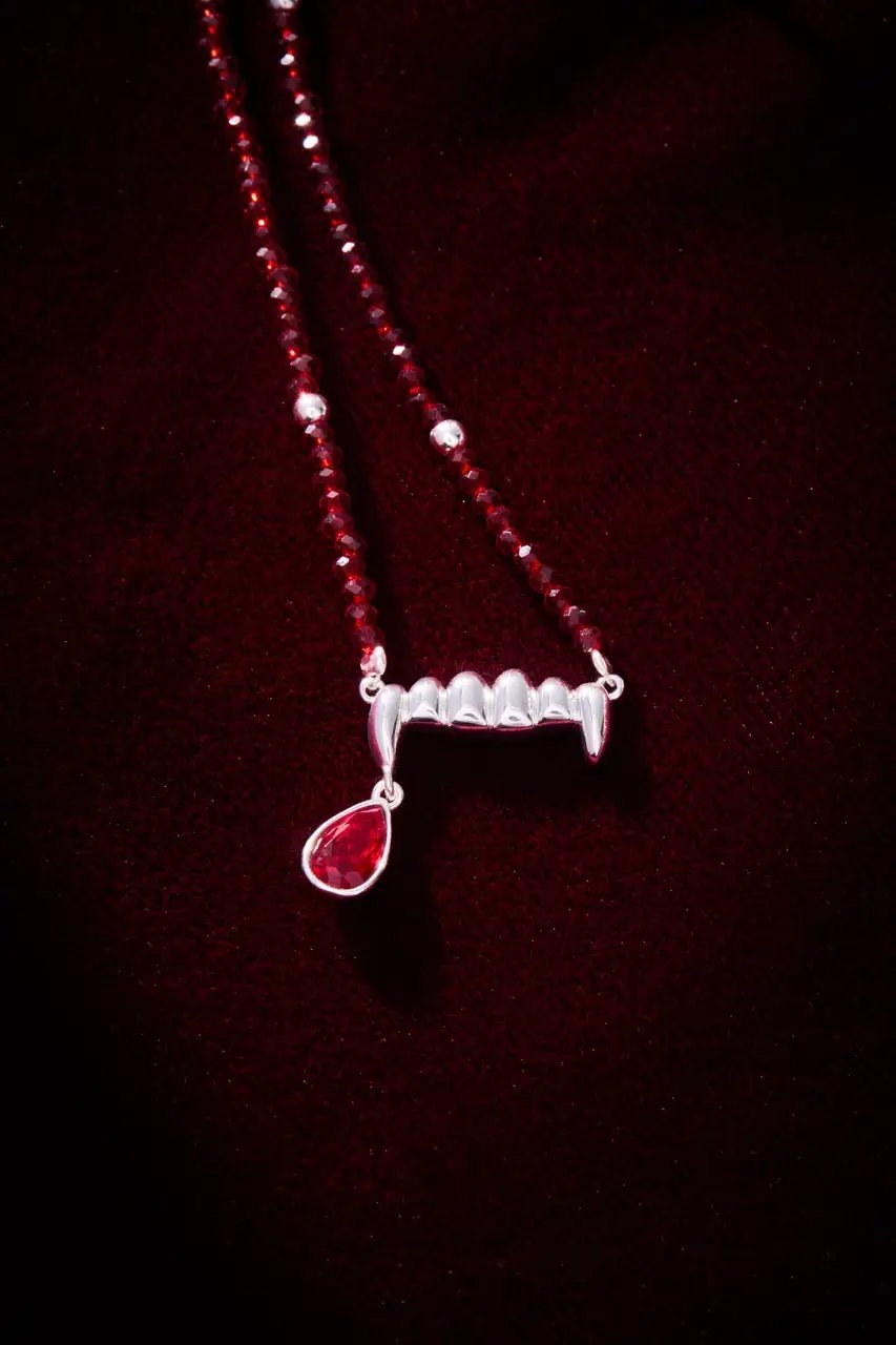Vampire Teeth Fangs Pendant Necklace with red faceted bead chain and a red teardrop gem on Tampa Home & Garden Store