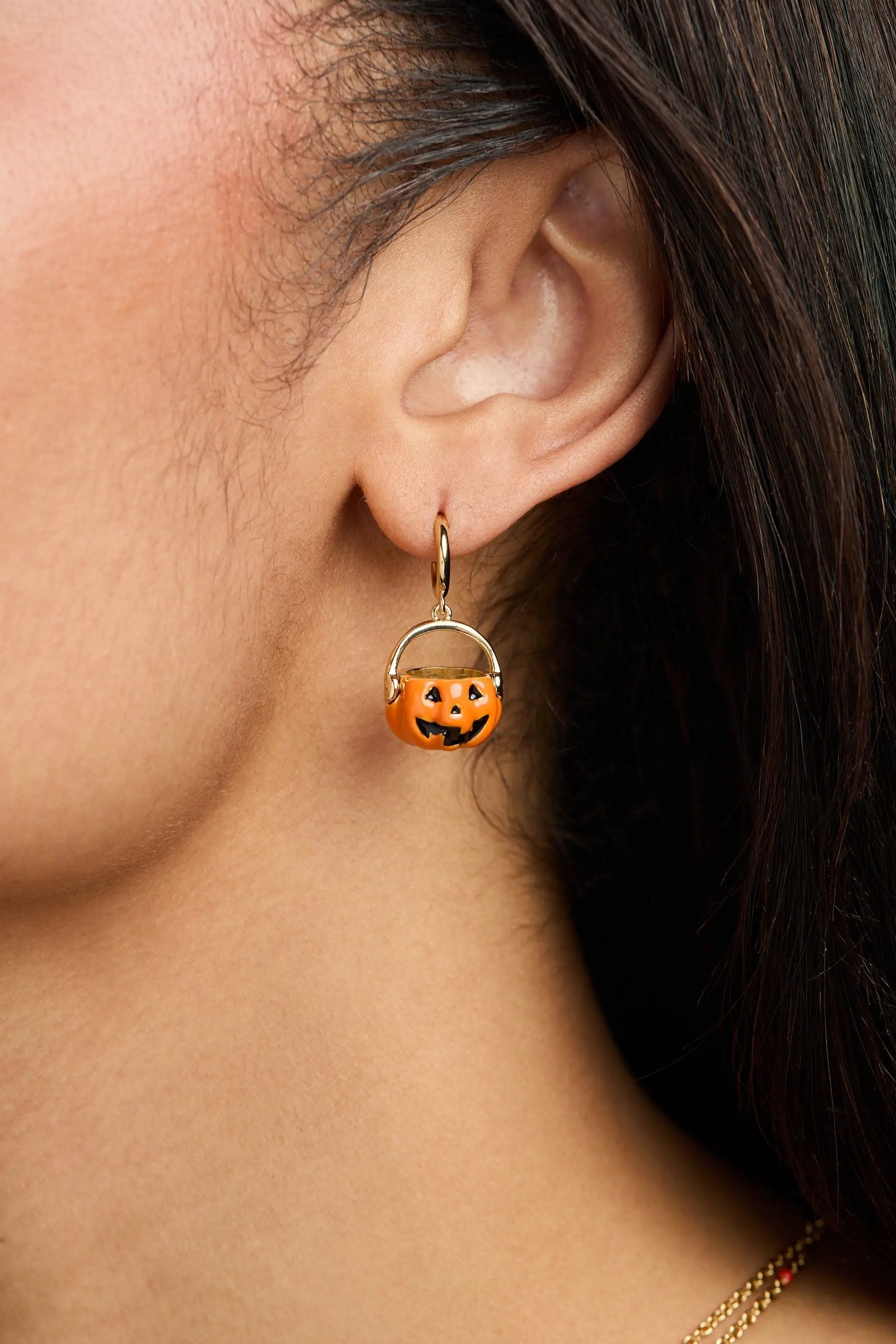 Trick or Treat pumpkin earring by Alex and Ani, orange jack-o'-lantern charm on gold-tone hoop on Tampa Home & Garden Store