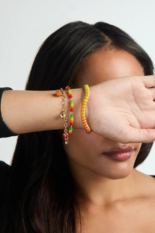 Trick or Treat Charm Bracelet by ALEX AND ANI with pumpkin charm and candy beads on wrist on Tampa Home & Garden Store