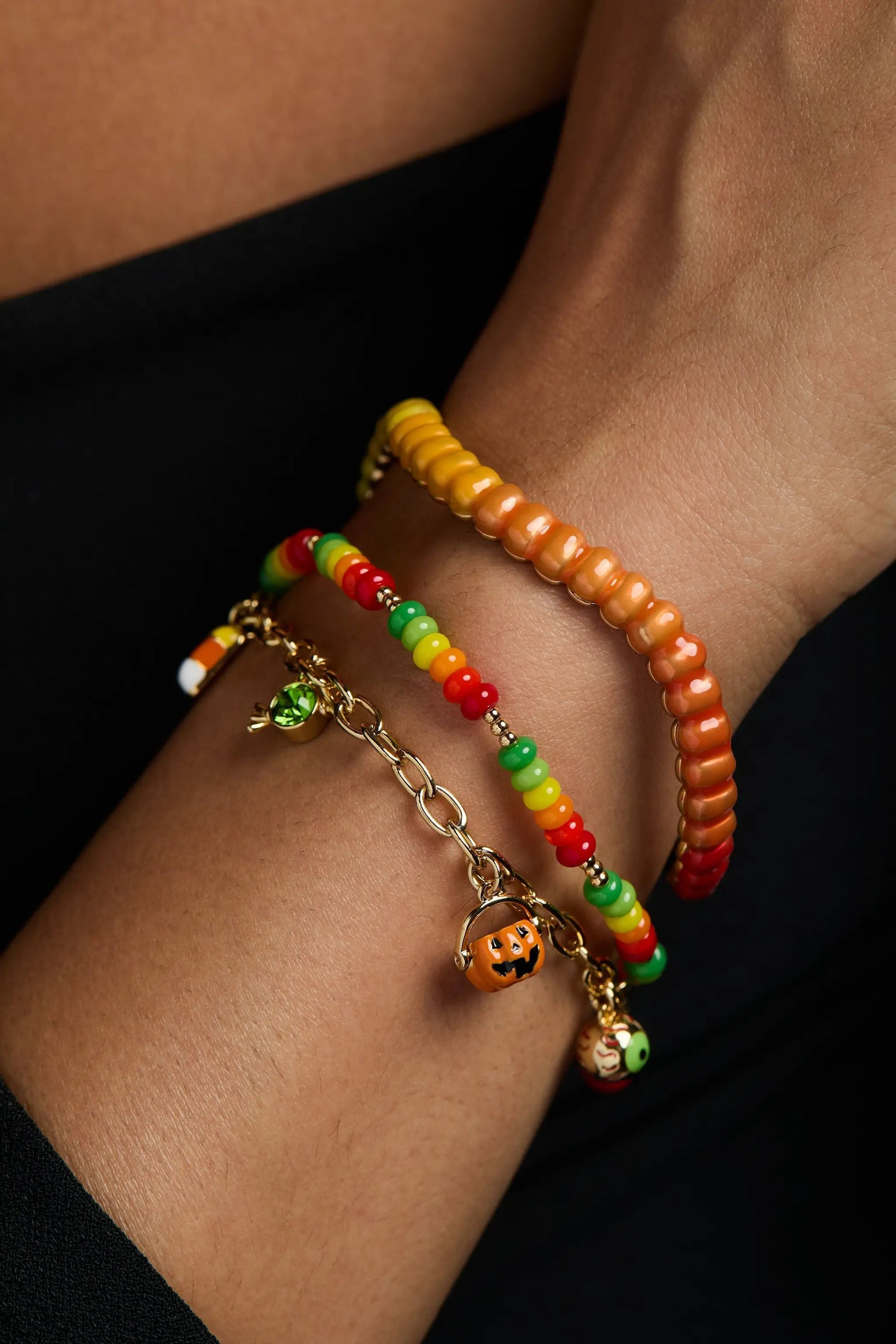 Gummy Worm Cuff bracelet by ALEX AND ANI, orange-yellow beads on a wrist with bead bracelets on Tampa Home & Garden Store