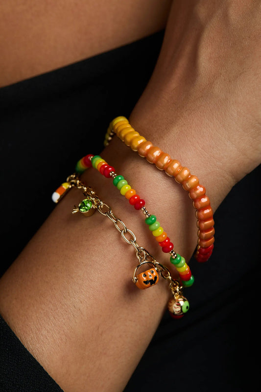 Gummy Worm Cuff bracelet by ALEX AND ANI, orange-yellow beads on a wrist with bead bracelets on Tampa Home & Garden Store