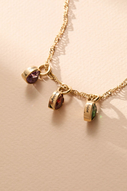 January Courage heart birthstone charms on gold chain with purple and green stones two charms by Alex and Ani on Tampa Home & Garden Store