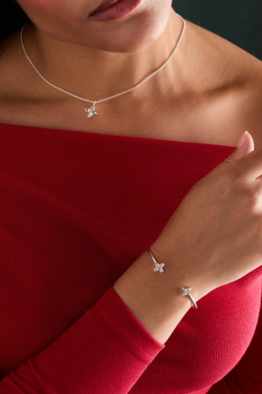 Crystal Logo Star Flex Cuff bracelet silver-tone with crystal star charm worn on the wrist on Tampa Home & Garden Store