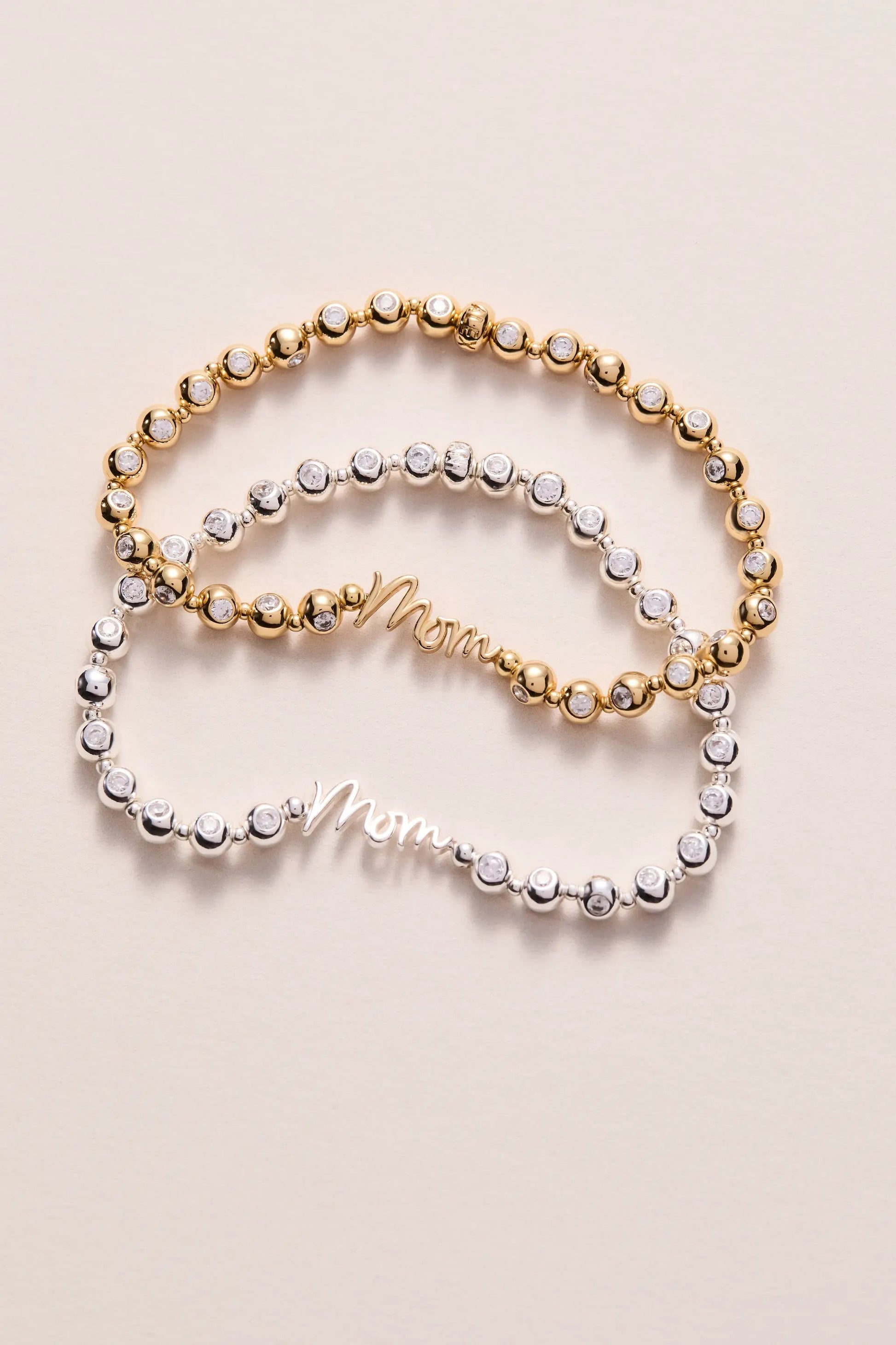 Pair of Mom elongated crystal stretch bracelets, gold and silver tone, crystal beads, by Alex and Ani on Tampa Home & Garden Store