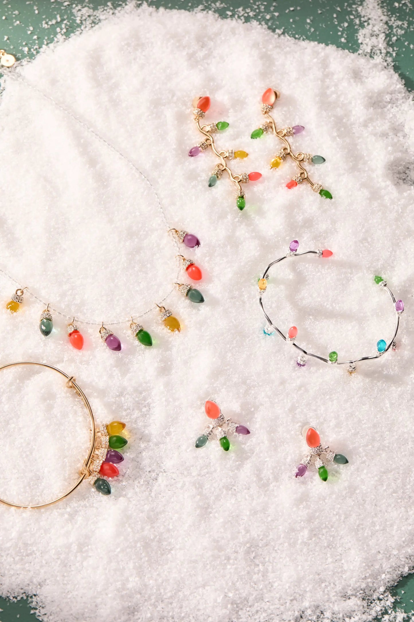 Bracelets Christmas Light Bulb Charm Bangle by ALEX AND ANI with bulb charms on snow on Tampa Home & Garden Store
