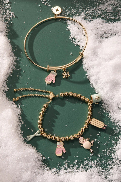 Winter Wonderland Mitten Bangle gold-tone bracelet with pink mitten and snowflake charms on Tampa Home & Garden Store