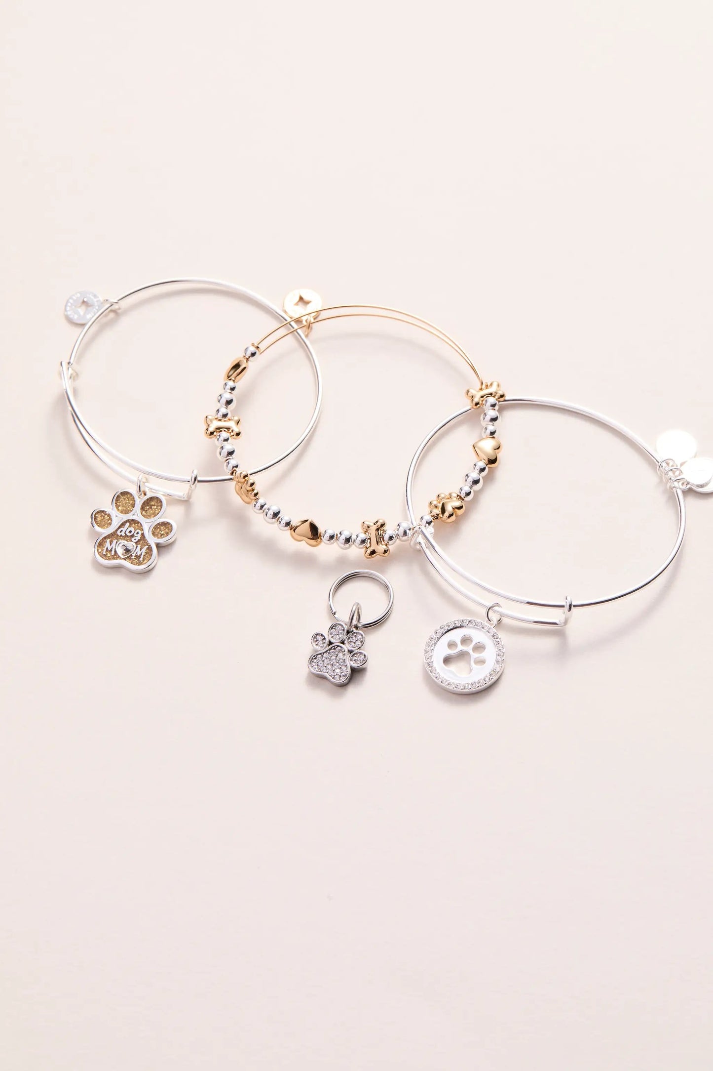 Dog Mom Charm Bangle set by ALEX AND ANI; silver and gold-tone hoops with paw charms on Tampa Home & Garden Store