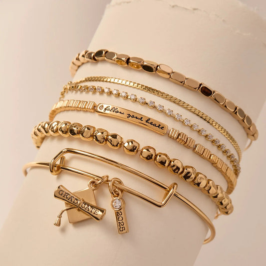 Follow Your Heart stretch bracelet by Alex and Ani in gold-tone among several bracelets on Tampa Home & Garden Store