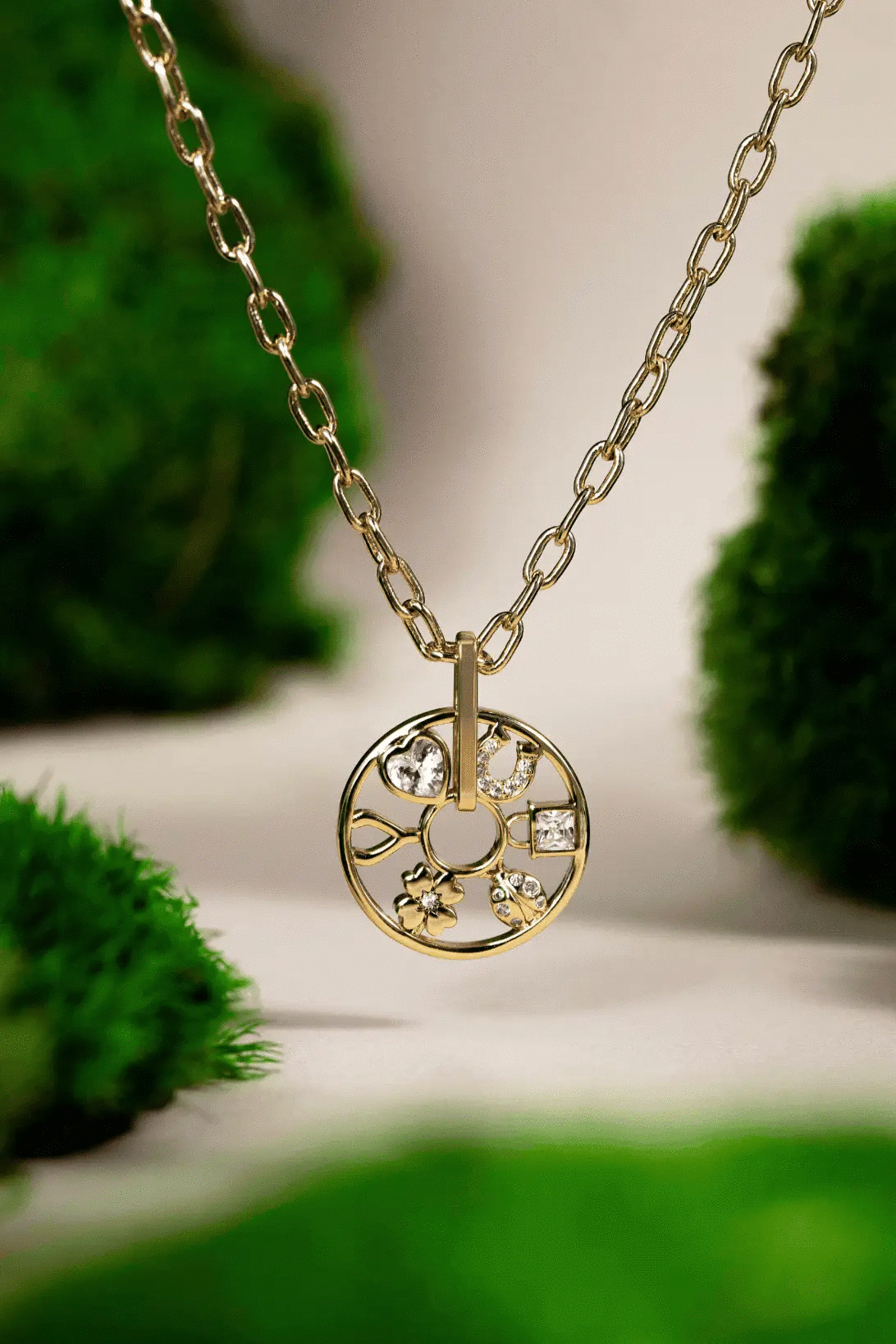 Love and Luck wheel charm necklace with crystal accents and gold chain on Tampa Home & Garden Store