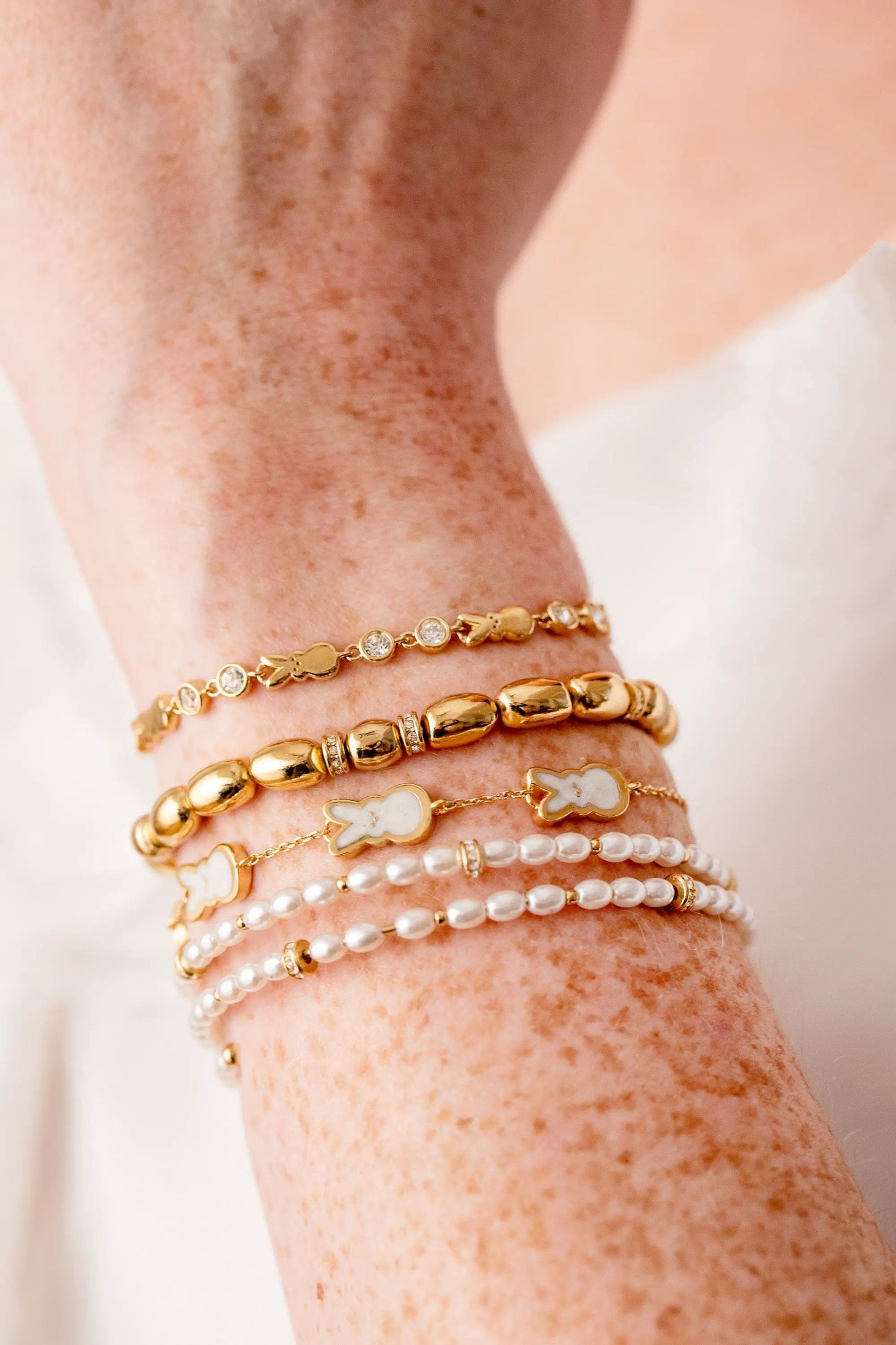 PEEPS Bunny Bolo Bracelet by ALEX AND ANI, gold beads, bunny charms and pearls in a stack on Tampa Home & Garden Store
