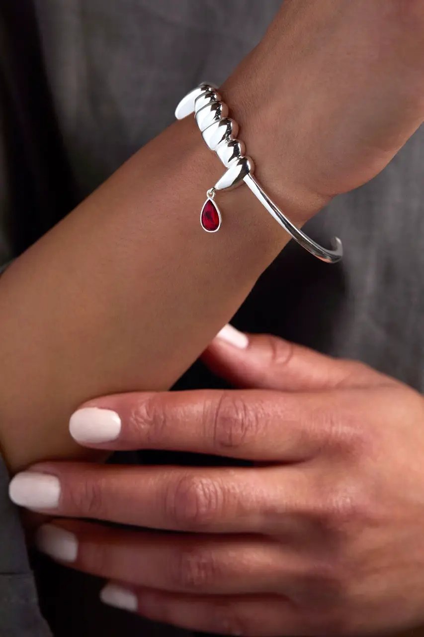 Bracelet Vampire Teeth Fangs Cuff in silver with a spiral band and red teardrop charm on Tampa Home & Garden Store