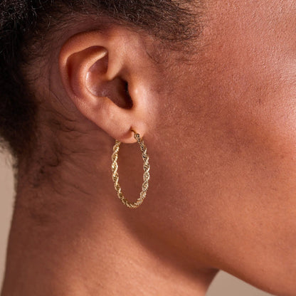 Frozen French Rope Hoop Earrings in gold-tone twisted rope hoop, close-up on ear on Tampa Home & Garden Store