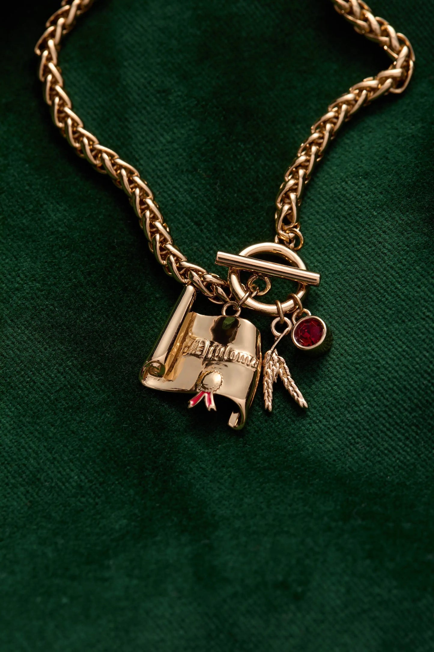 The Wizard of Oz™ Scarecrow Toggle Bracelet gold chain with toggle clasp and red gemstone charm on Tampa Home & Garden Store