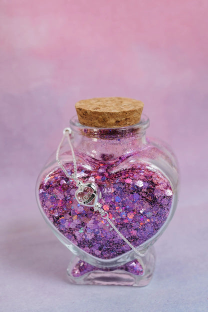 Harry Potter Love Potion bracelet with pink glitter bottle pendant and silver heart charm on Tampa Home & Garden Store