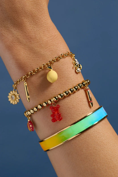 Crayola Rainbow Gradient Cuff bracelet featuring a multicolor enamel rainbow band with gold-tone accents on wrist on Tampa Home & Garden Store