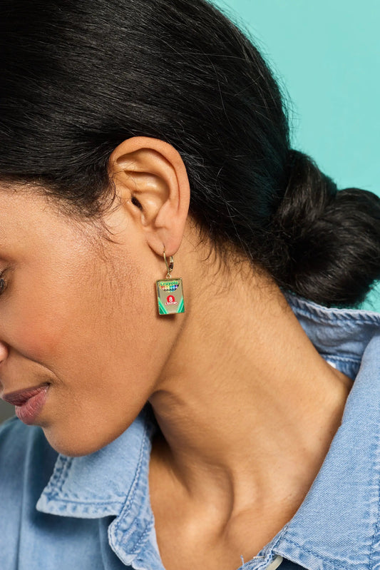 Crayola Crayon Box Earrings on a goldtone hoop with a rectangular pendant showing rainbow crayons on Tampa Home & Garden Store