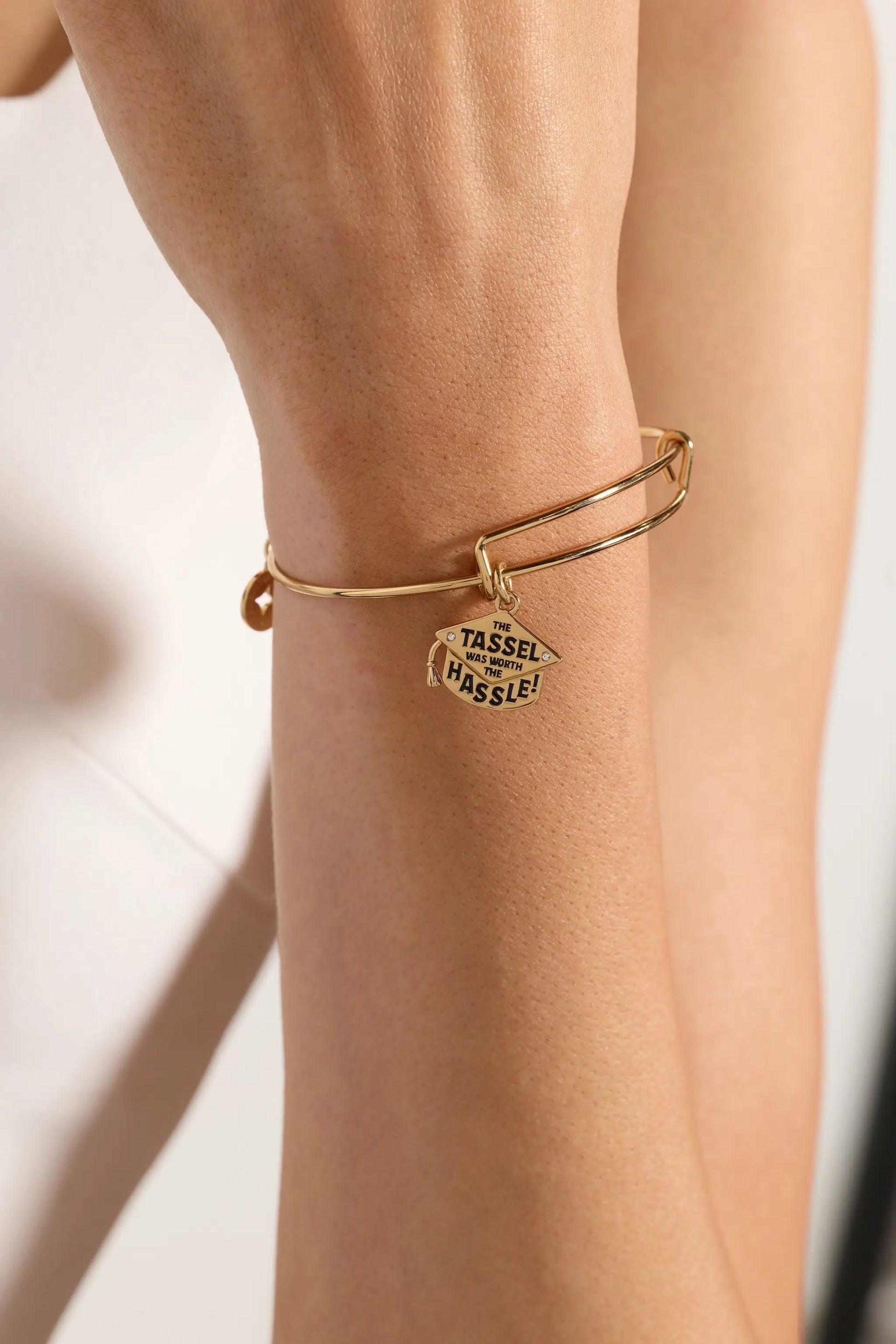 The Tassel Was Worth The Hassle Charm Bangle gold-tone bracelet by ALEX AND ANI on wrist on Tampa Home & Garden Store