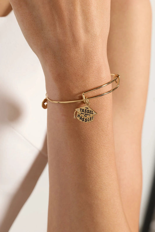 The Tassel Was Worth The Hassle Charm Bangle gold-tone bracelet by ALEX AND ANI on wrist on Tampa Home & Garden Store