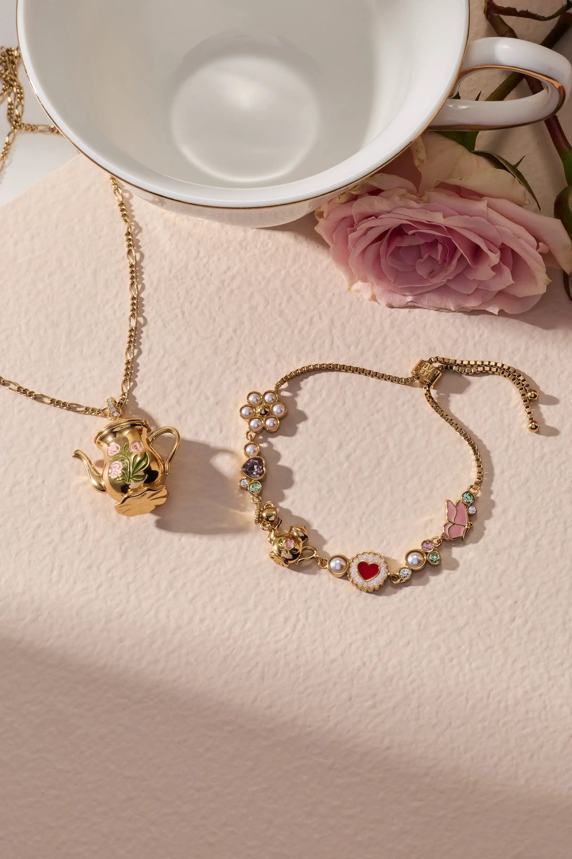 Tea Party Bolo Bracelet by Alex and Ani, gold-tone chain with enamel and pearl charms on Tampa Home & Garden Store