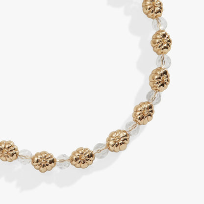 Bracelet: Pumpkin + Crystal Beaded Bangle by ALEX AND ANI with gold pumpkins and clear crystals on Tampa Home & Garden Store