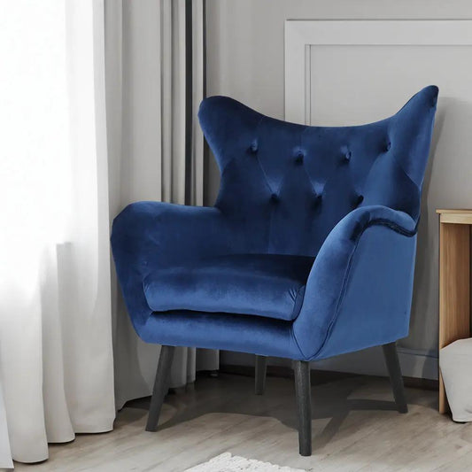 Navy velvet arm chair with tufted back and tapered legs on Tampa Home & Garden Store