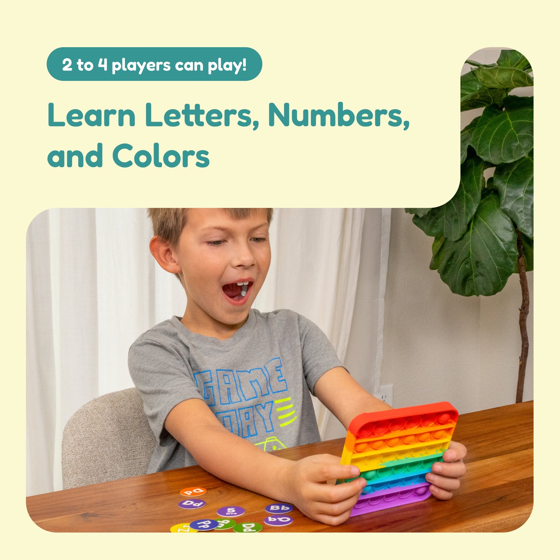 ABC BINGO! educational toy with rainbow pop-it and alphabet tiles, child playing on Tampa Home & Garden Store