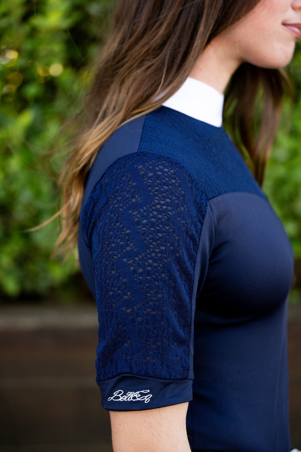 OLIVIA Show Shirt, navy blue equestrian with lace sleeves and white collar, BellEq logo on cuff on Tampa Home & Garden Store