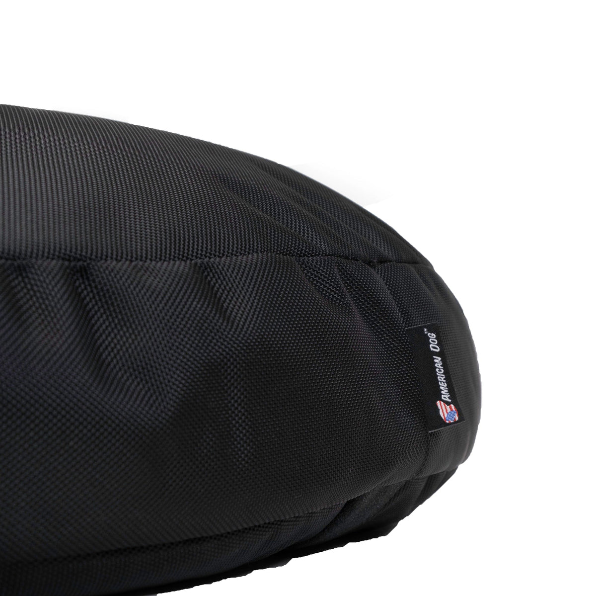 Dog Bed Round Armor™ in black rugged fabric with American Dog tag on Tampa Home & Garden Store