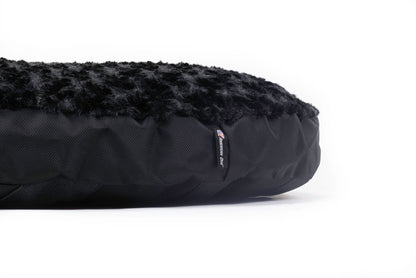 Dog Bed Round Furvana™ by American Dog with black faux fur top and quilted black fabric base on Tampa Home & Garden Store