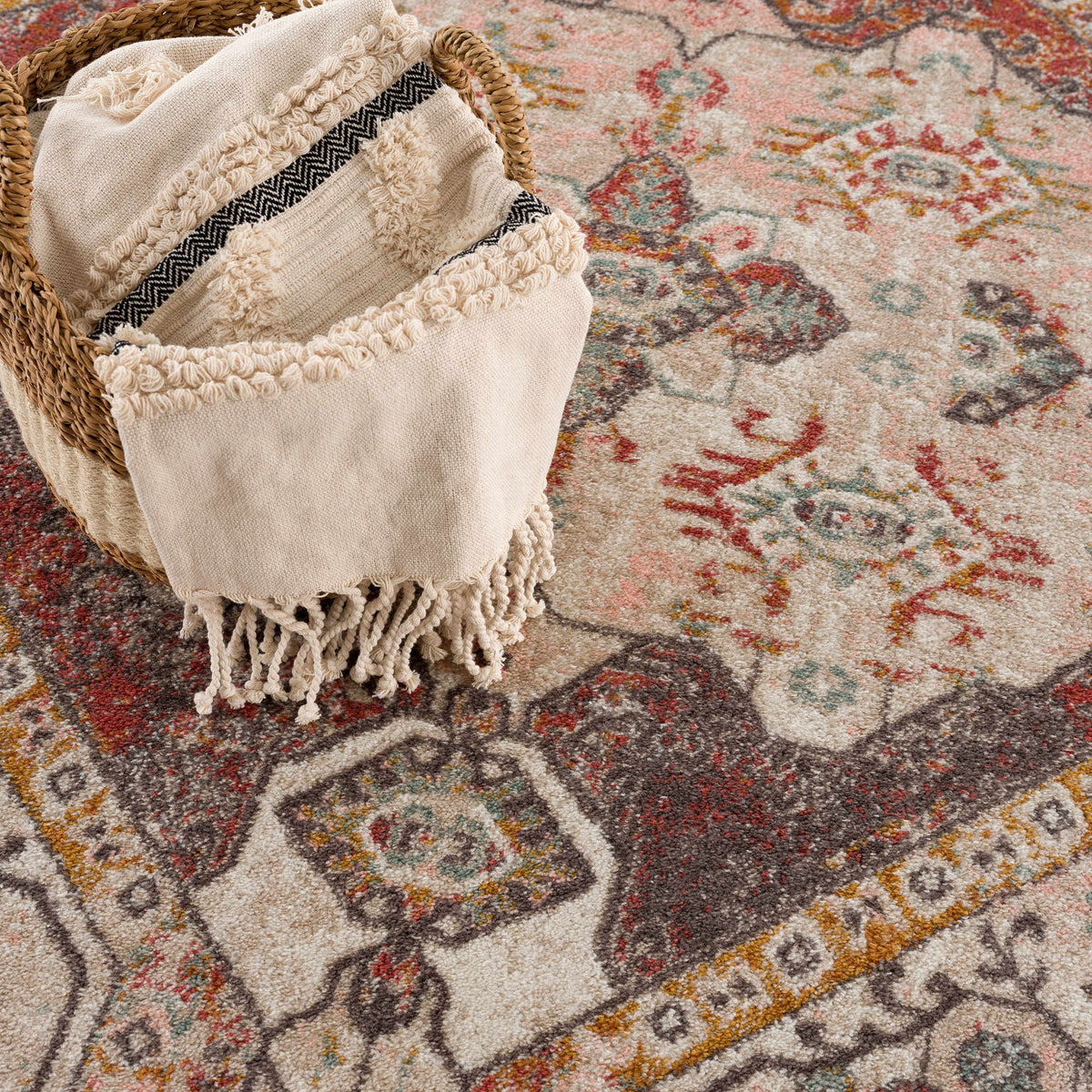 Yennora area rug by Boutique Rugs; beige base with muted pink and teal accents, ornate pattern on Tampa Home & Garden Store