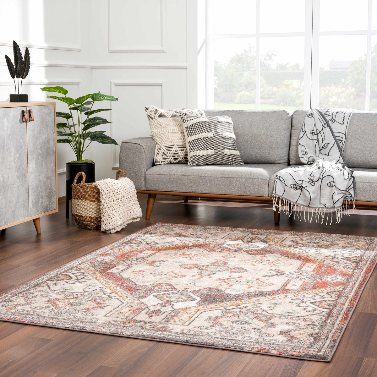 Yennora Area Rug by Boutique Rugs in warm multicolor geometric pattern in living room on Tampa Home & Garden Store
