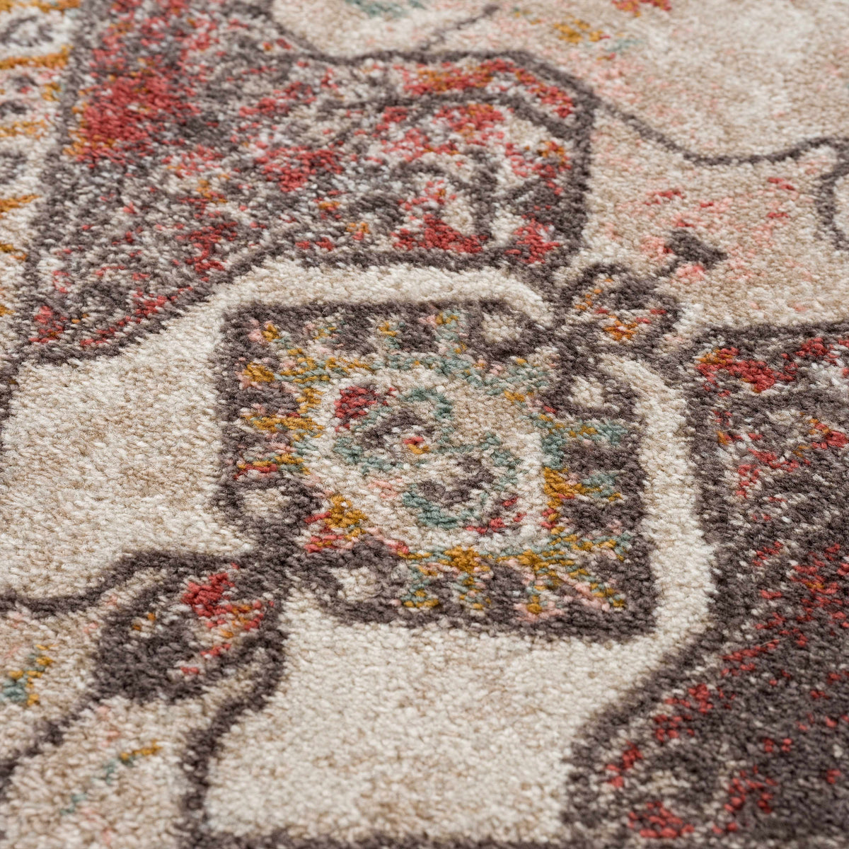 Yennora Area Rug multi-color beige brown red teal abstract pattern close-up Boutique Rugs on Tampa Home & Garden Store