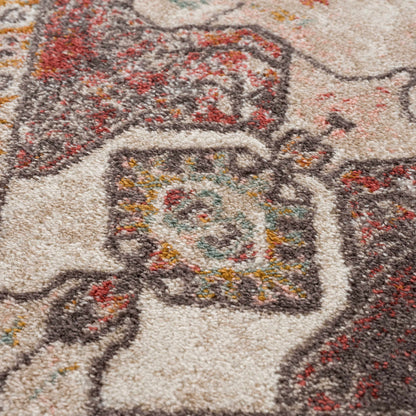 Yennora Area Rug multi-color beige brown red teal abstract pattern close-up Boutique Rugs on Tampa Home & Garden Store