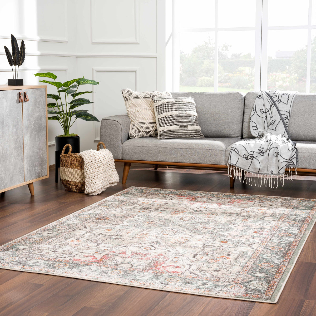 Bolinas Area Rug by Boutique Rugs, neutral gray/ivory distressed pattern with orange accents on Tampa Home & Garden Store