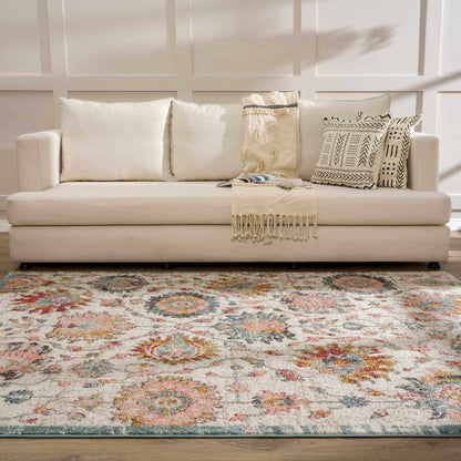 Twilight Floral Area Rug cream with multicolor floral pattern under a beige sofa on Tampa Home & Garden Store