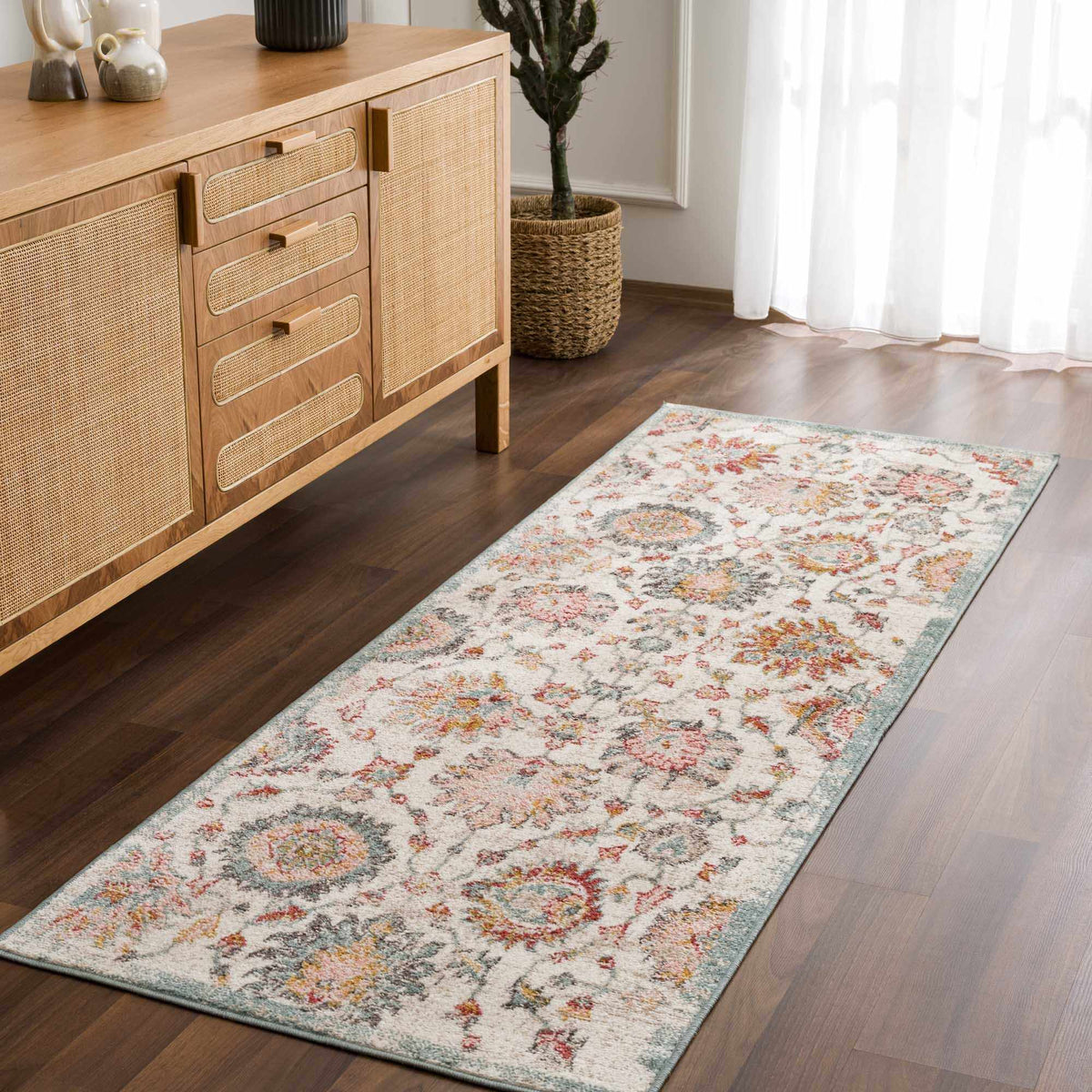 Twilight Floral Area Rug by Boutique Rugs, cream runner with pink teal orange florals on wood floor on Tampa Home & Garden Store