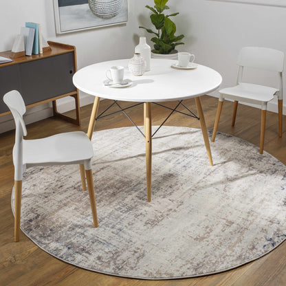 Alcove Abstract Area Rug with neutral gray beige pattern under a white round dining table on Tampa Home & Garden Store