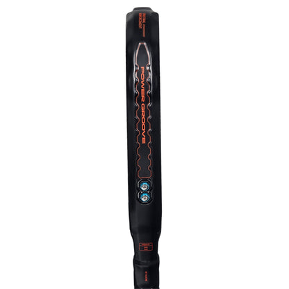 Padel racket Metalbone 2026 in black with orange Power Groove graphic, vertical view on Tampa Home & Garden Store