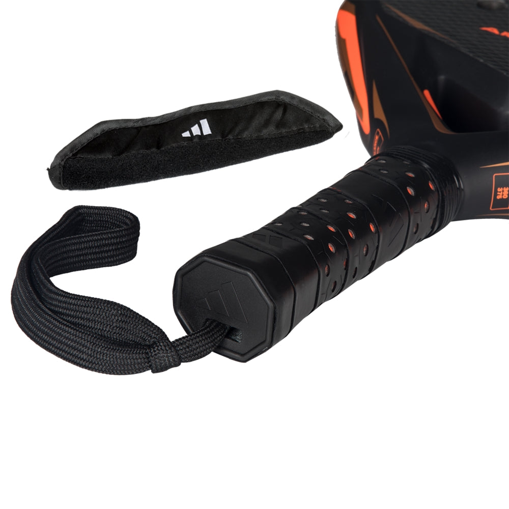 Padel racket Adidas Arrow Hit Ctrl with black perforated grip, orange accents and wrist strap on Tampa Home & Garden Store