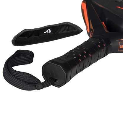 Padel racket Adidas Arrow Hit Ctrl with black perforated grip, orange accents and wrist strap on Tampa Home & Garden Store