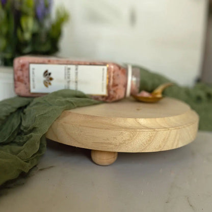 Rustic Round Wood Jewelry Tray on Pedestal with green fabric and pink Gia Roma bottle on Tampa Home & Garden Store