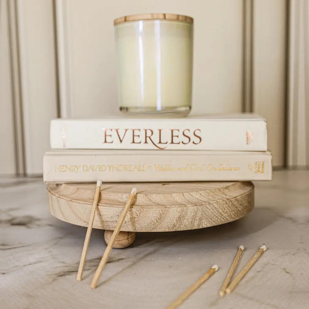 Rustic Round Wood Jewelry Tray on Pedestal in natural wood finish with candle and stacked books on Tampa Home & Garden Store