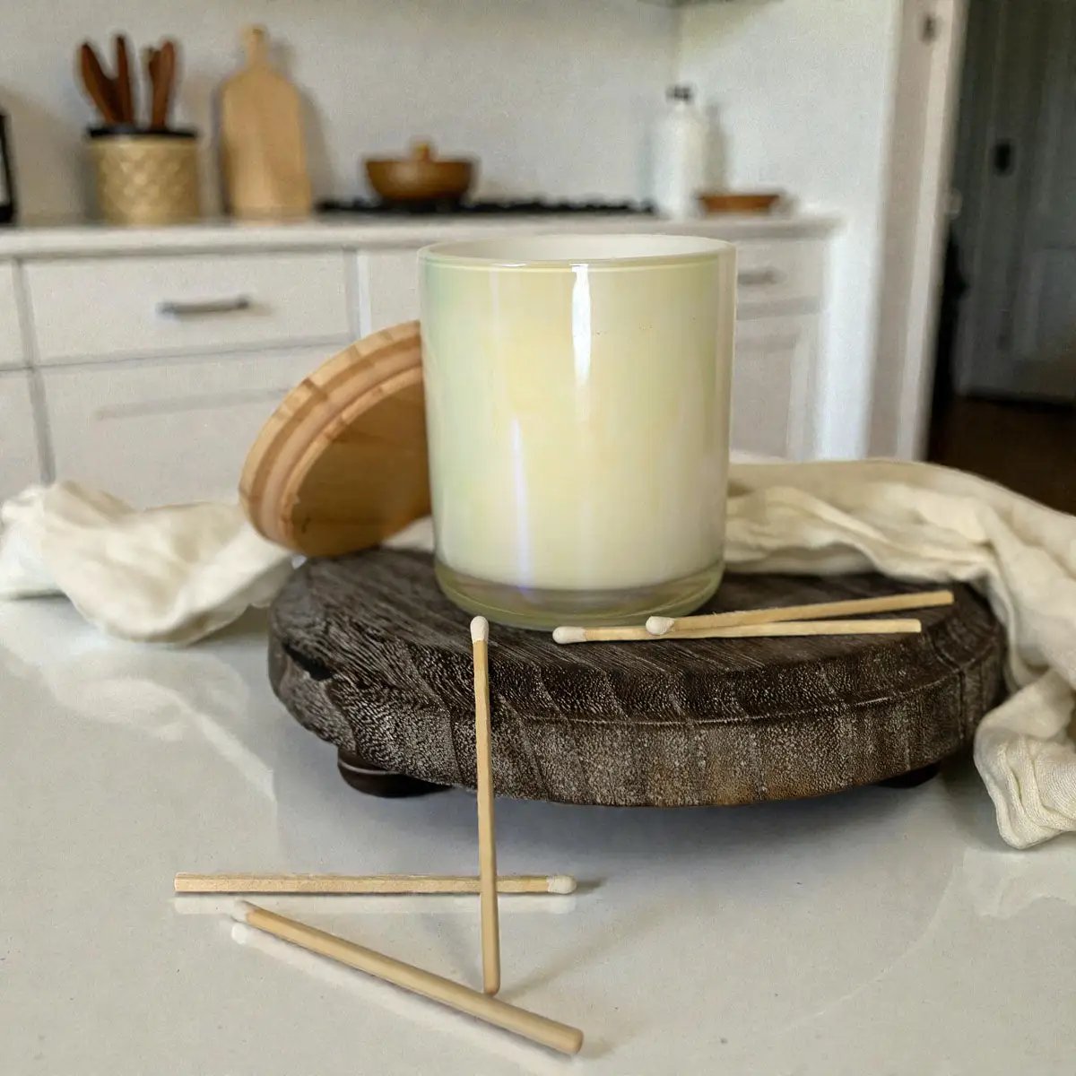 Gia Roma rustic round wood jewelry tray on pedestal with pale ceramic vessel and matches on Tampa Home & Garden Store