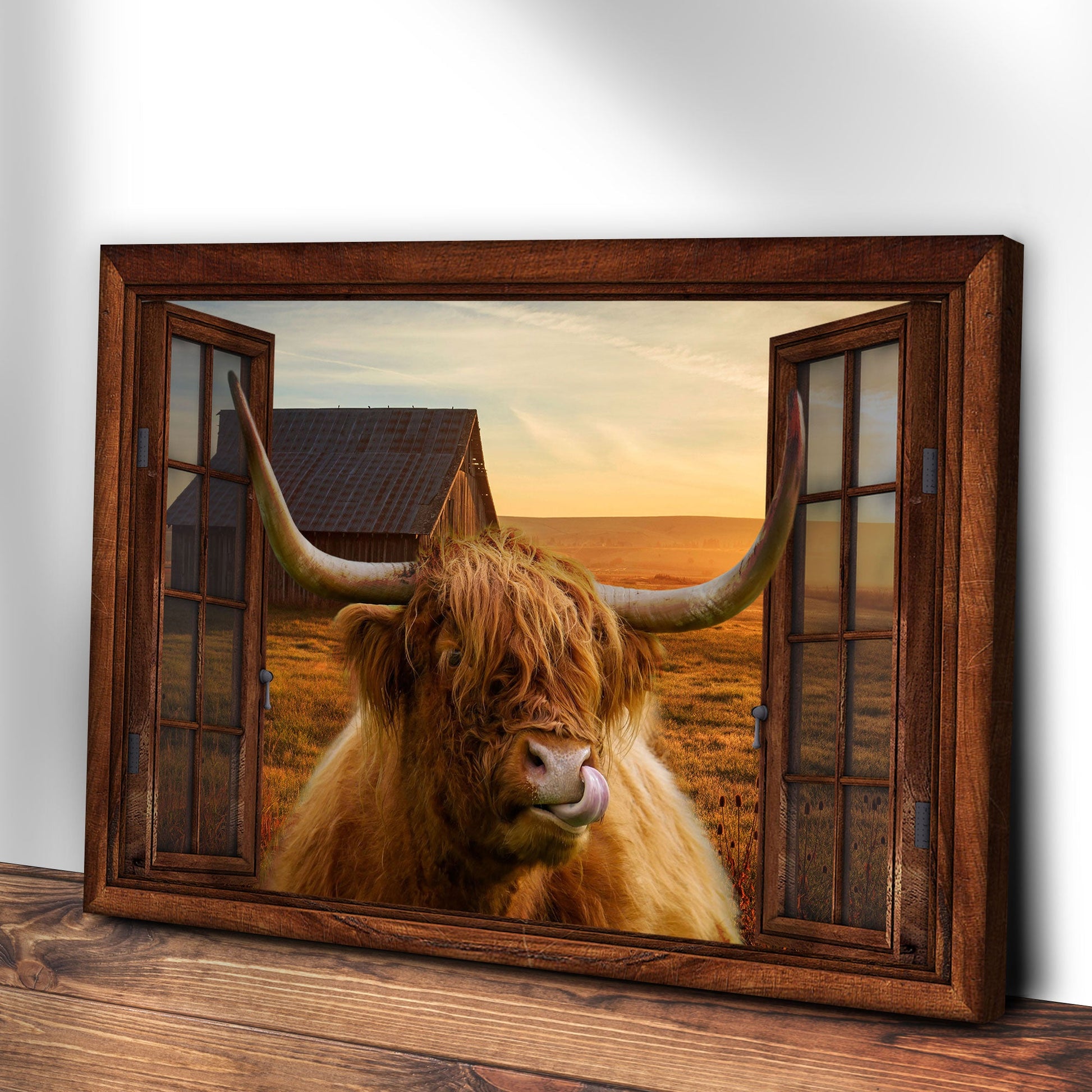 Highland Cow Window View Canvas Wall Art in a rustic wood frame with a long-horned cow at sunset on Tampa Home & Garden Store